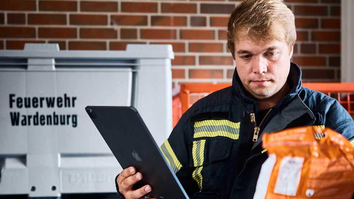 Finn checking the equipment at Wardenburg voluntary fire service.