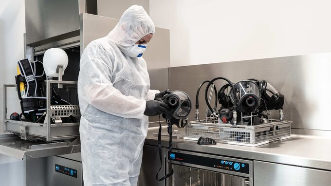 SCBA technician dismantles BA masks and SCBAs SCBA technician dismantles BA masks and SCBAs