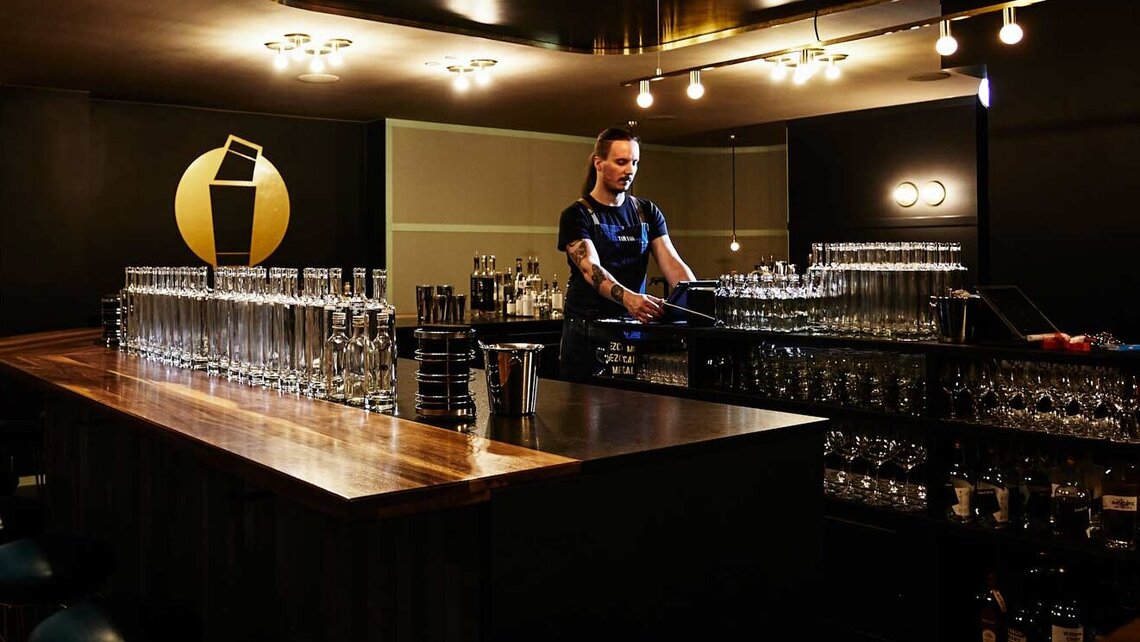 Jonas Hald in his bar shortly before pouring cocktails into bottles.