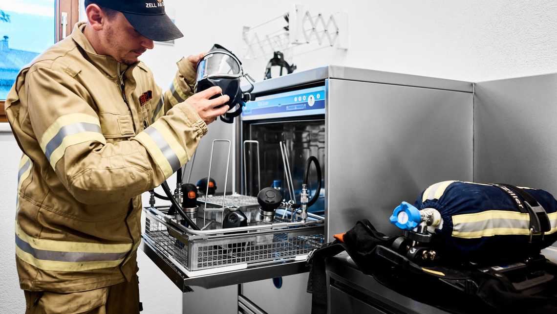Martin loads BA masks into the TopClean M for cleaning.